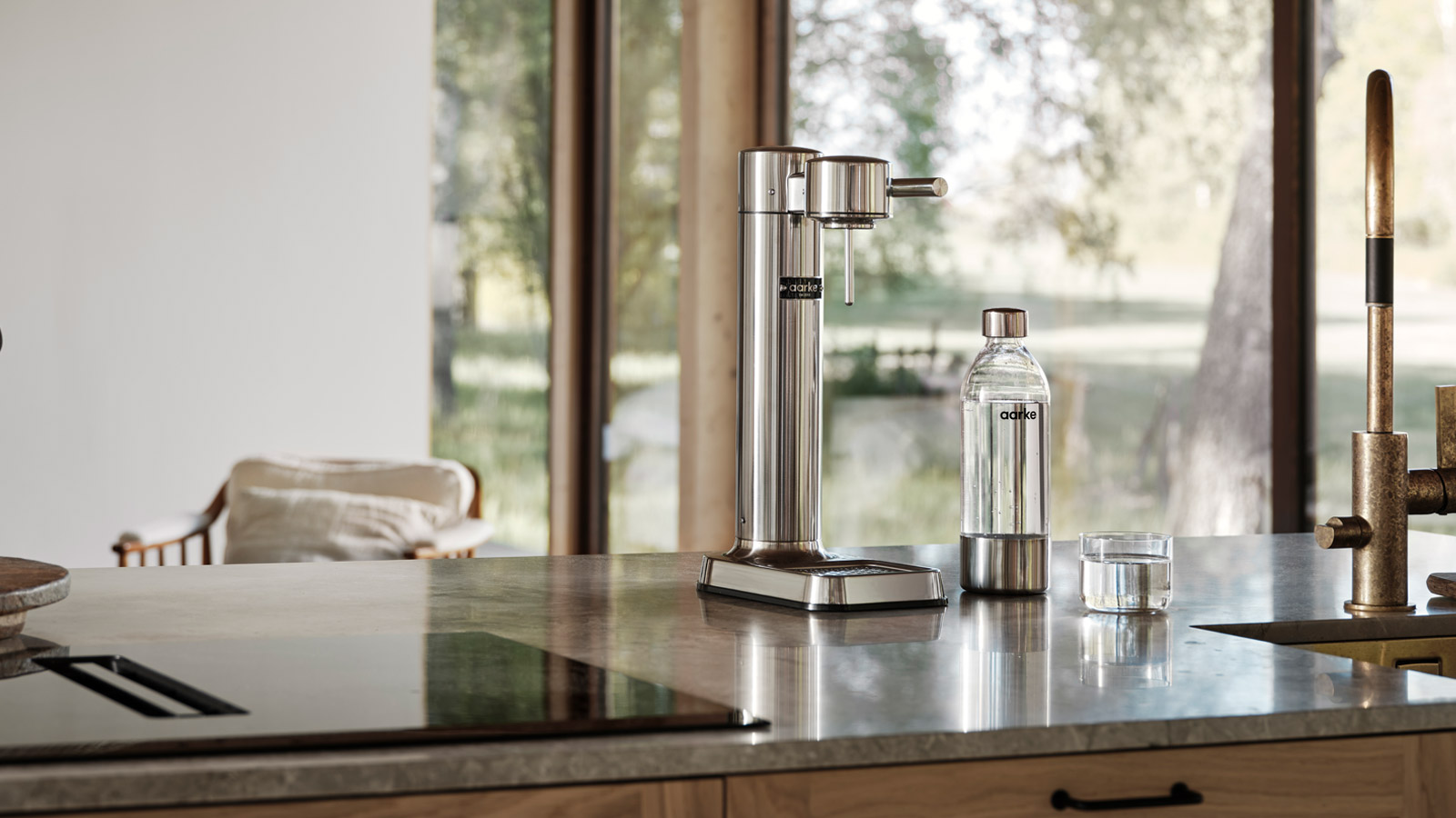 Aarke carbonator on a sunlit kitchen counter